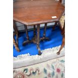 A Victorian mahogany occasional top having octagonal top and turned legs on ecclesiastical style