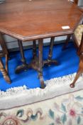 A Victorian mahogany occasional top having octagonal top and turned legs on ecclesiastical style