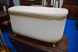 A vintage woven fibre blanket box