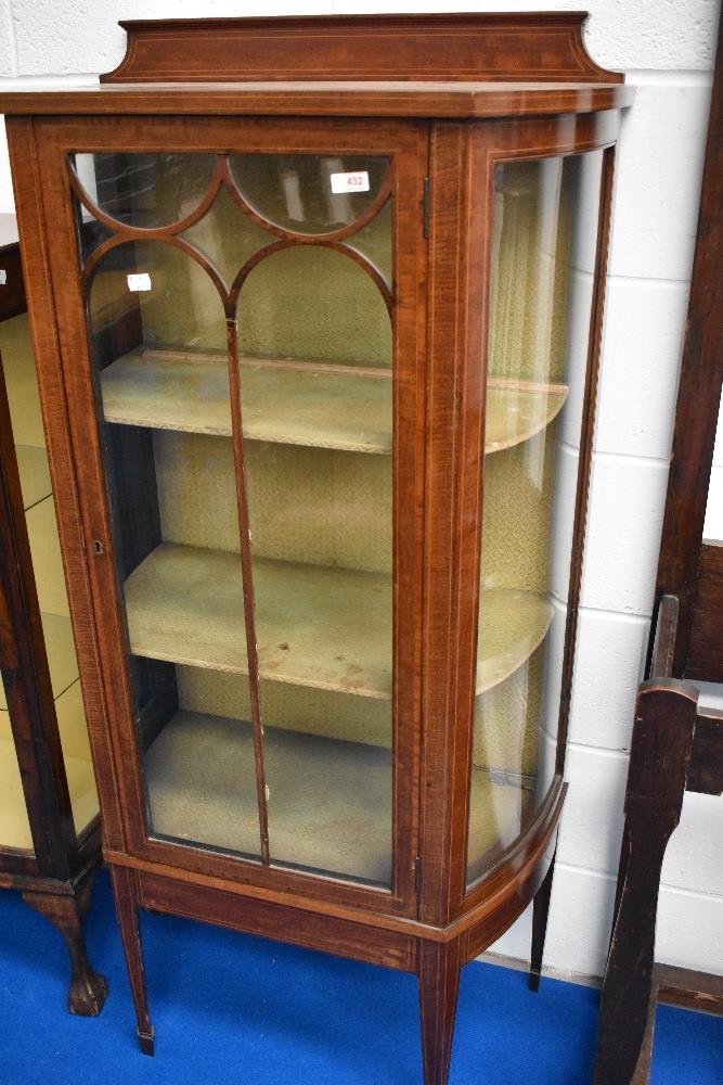 An Edwardian mahogany display cabinet of narrow proportions