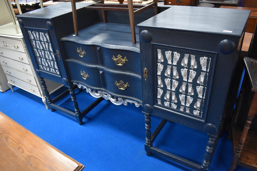 A painted sideboard having leopard themed papered panels