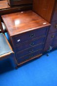 A reproduction regency style low chest of four bedside or similar drawers
