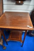 An Edwardian mahogany side table