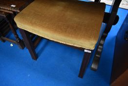 A vintage mahogany dressing table stool