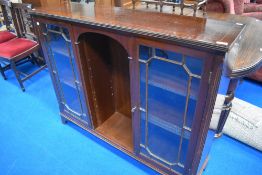 A reproduction Regency style low bookcase with open shelves to centre