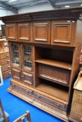 A vintage oak Continental style side cabinet of interesting design