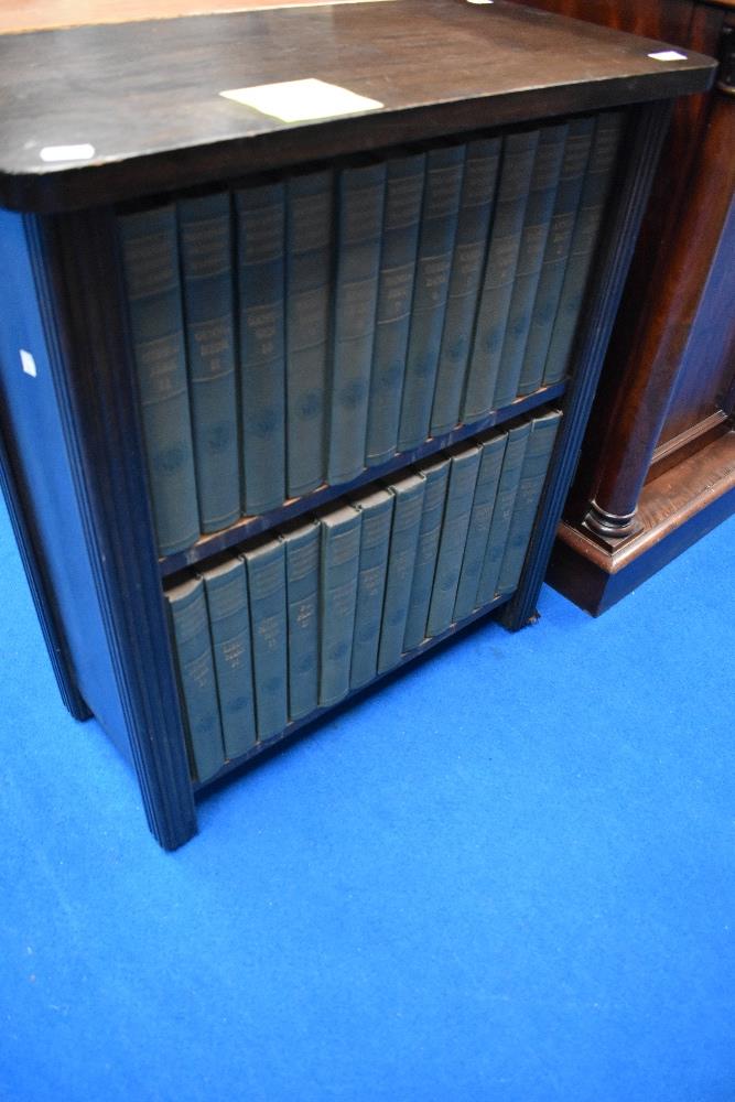 An early 20th Century stained frame low bookshelf containing set of Encyclopedia Brittannica (14th