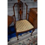 An Edwardian mahogany carver chair