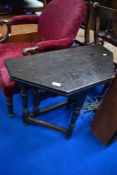 An interesting and unusual period oak occasional table having gateleg and fold over top