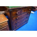 A Victorian mahogany chest of three over three drawers on bun feet