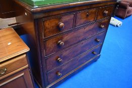A Victorian mahogany chest of three over three drawers on bun feet