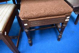 A 19th Century mahogany dressing table stool having vintage moquette upholstered seat