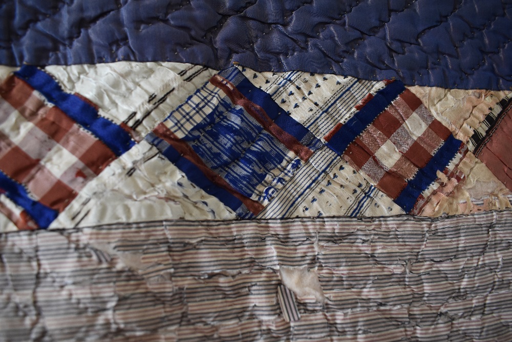 A Victorian silk quilt, having chevron cotton reverse in coffee coloured cotton, edges are - Image 2 of 7