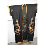 An early 20th century silk kimono dressing gown with frog fastenings, embroidered with dragon