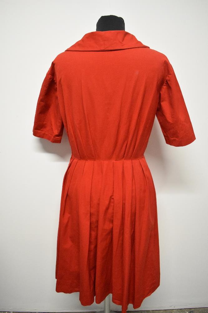 A 1950s medium weight cotton cherry red day dress, having large statement buttons, ties to neck, - Image 4 of 7