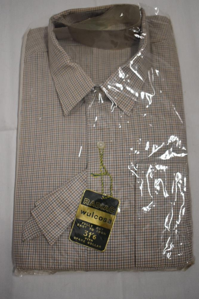 A 1950s 'Radiac' gents collarless shirt, in green and brown fine check, as new, in packaging, with