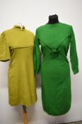 Two wool day dresses, chartreuse 1960s mini dress and emerald green late 50s/60s dress with bow to