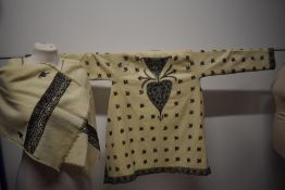 A scarce 1940s wool coat and matching shawl (kashmiri?) having extensive embroidery throughout,