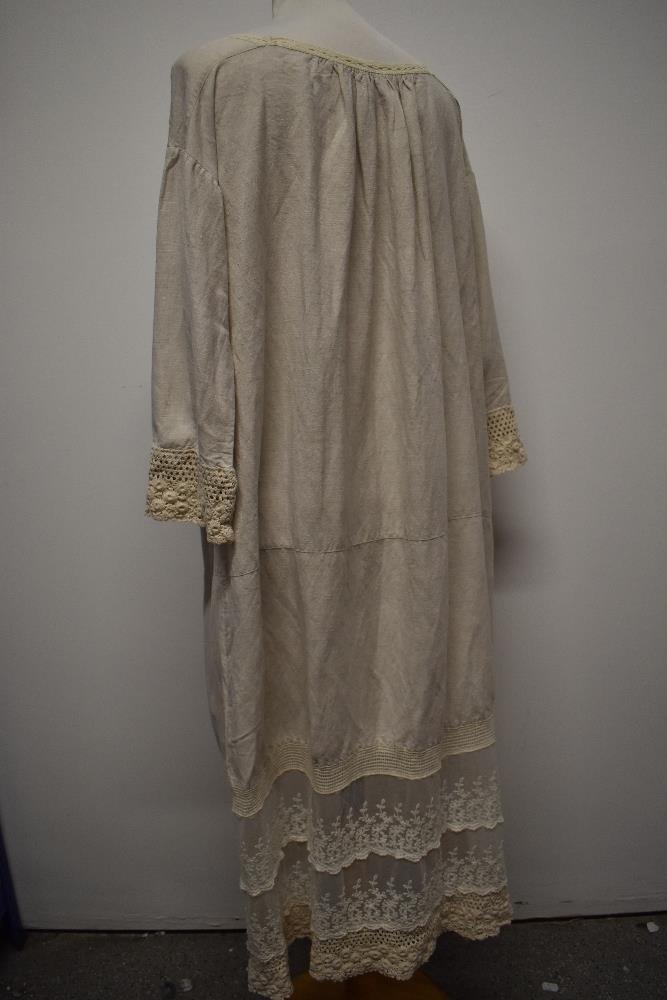 An interesting early 20th century linen smock/ over dress, having embroidered tulle panel to - Image 8 of 12