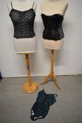 A 1940s boned black lace and blue crepe bustier, a 1960s strapless black lace bustier and a 1960s