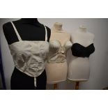 A 1950s 'Silhouette' bustier, a 1950s spiral stitch strapless bra and an early 20th century bralette