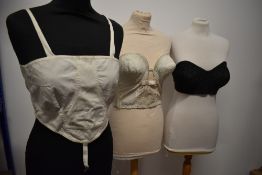 A 1950s 'Silhouette' bustier, a 1950s spiral stitch strapless bra and an early 20th century bralette