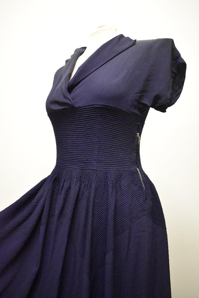 A striking 1940s navy blue floppy crepe day dress, having pointed cross over collar and tiny ribs of - Image 11 of 12