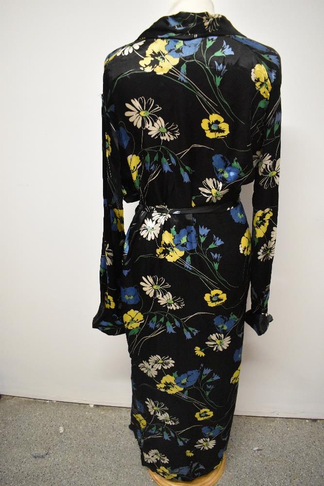 A 1940s glossy black rayon house coat, having vibrant floral pattern, very satin like to the touch. - Image 7 of 7