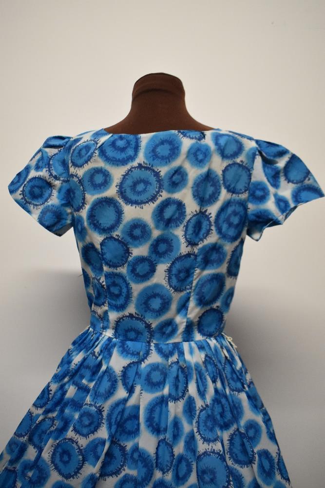 A blue 1950s day dress, having side metal zip, fairly full pleated skirt and bow detail to - Image 7 of 7