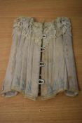 A Victorian dolls corset, a brilliant miniature replica of an adults corset, with boning, hook and