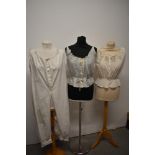 Two Victorian lawn cotton camisoles/ corset covers, having Embroidery to one and extensive cutwork