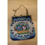 A late Victorian beaded evening bag, having brass frame with chain handle.