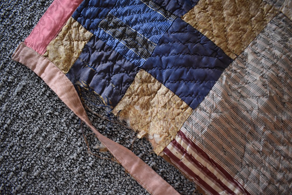 A Victorian silk quilt, having chevron cotton reverse in coffee coloured cotton, edges are - Image 5 of 7