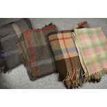 Three vintage tartan rugs and a cot or pram blanket.