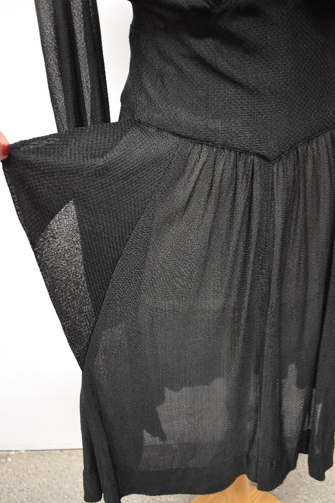 A late 1930s/early 40s semi sheer black day dress, having peplum detail to pointed dropped - Image 2 of 8