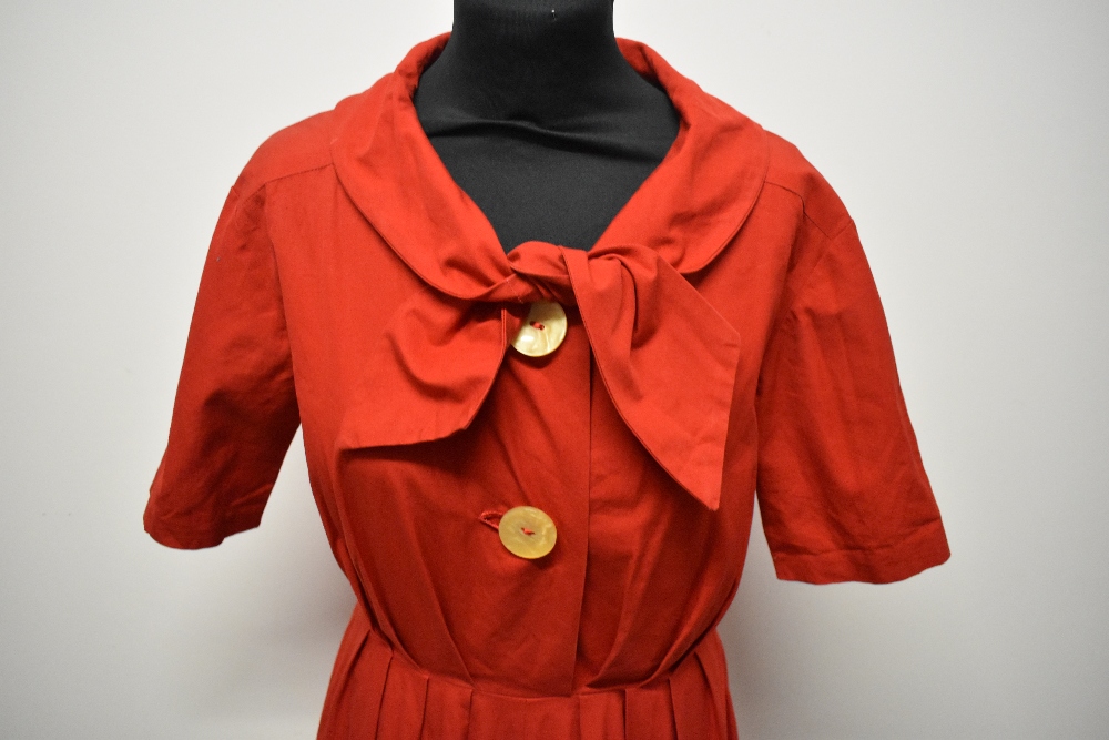 A 1950s medium weight cotton cherry red day dress, having large statement buttons, ties to neck, - Image 2 of 7