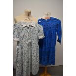 A mixed lot of childrens and babies clothing, including 1950s child's dress, 1970s blue dress and an