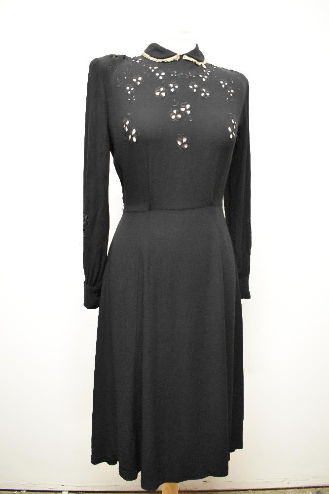 An unusual 1930s/40s day dress of black crepe with floral cut work to bodice and sleeves, lace