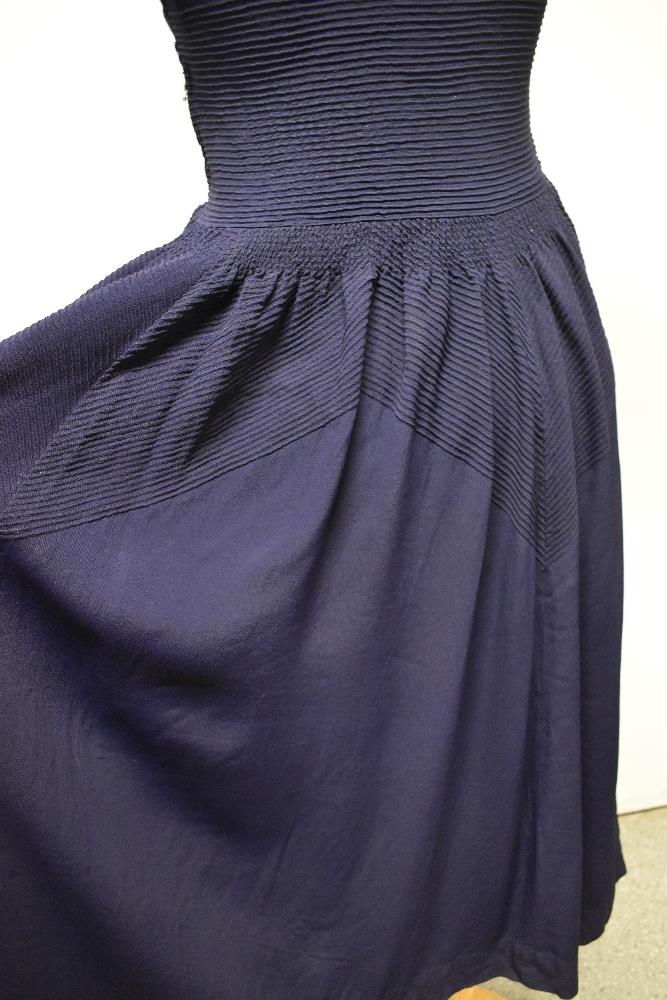 A striking 1940s navy blue floppy crepe day dress, having pointed cross over collar and tiny ribs of - Image 9 of 12