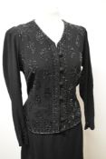 A late 1930s/40s black crepe dress, having extensive beadwork to bodice, self covered buttons to