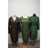 Three 1960s shift dresses, in green and brown hues, including emerald green dress with abstract leaf