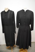 A 1940s crepe day dress, having buttons to front and cuffs, side metal zip and short zip to cuffs