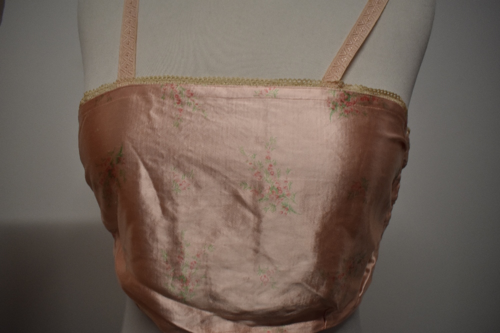 A 1940s strapless pink satin finish bra and a 1920s bralette with shirred back. - Image 2 of 10