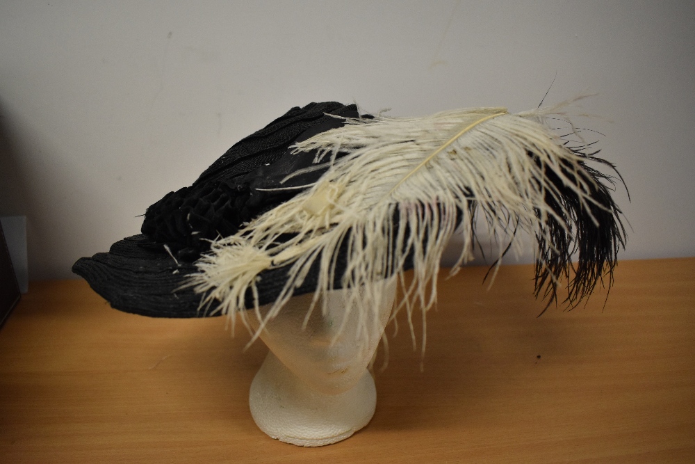 An Edwardian black straw hat, having feathers and velvet trim to brim and two hat pins. - Image 2 of 7