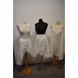 Two pairs of Victorian bloomers having lace to legs and a set of Victorian/ Edwardian cami knickers/
