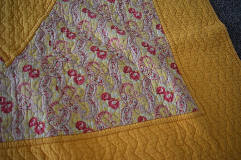 A 1930s/40s 'The Comfy' quilt, having paisley diamond to centre with block yellow surround and - Image 2 of 5