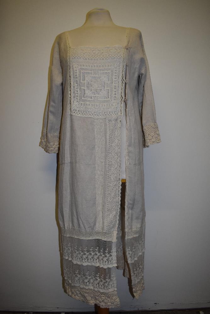 An interesting early 20th century linen smock/ over dress, having embroidered tulle panel to - Image 2 of 12