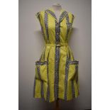 A rather fun 1950s cotton day dress, in medium weight cotton, having bands of grey with white