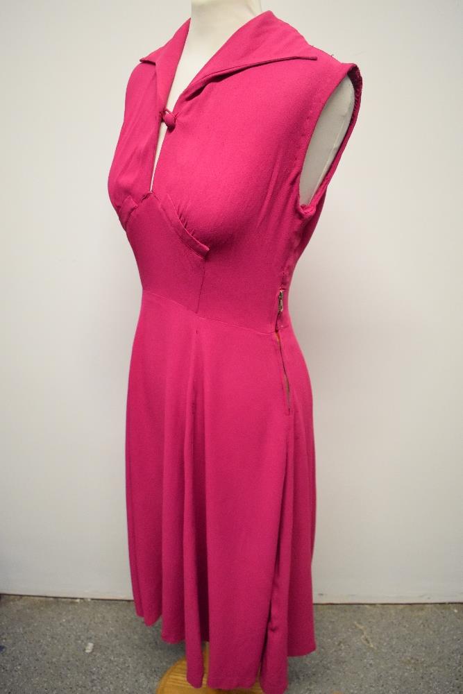 A 1940s cerise crepe dress, having button to bodice, side metal zip and fairly full panelled skirt. - Image 3 of 7