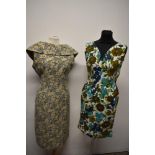 Two 1950s dresses, including late 50s metallic thread floral dress with shawl collar and floral bark